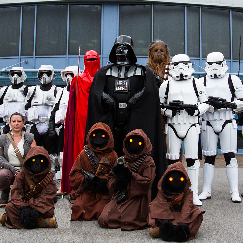 Darth Vader flanked by Stormtroopers.